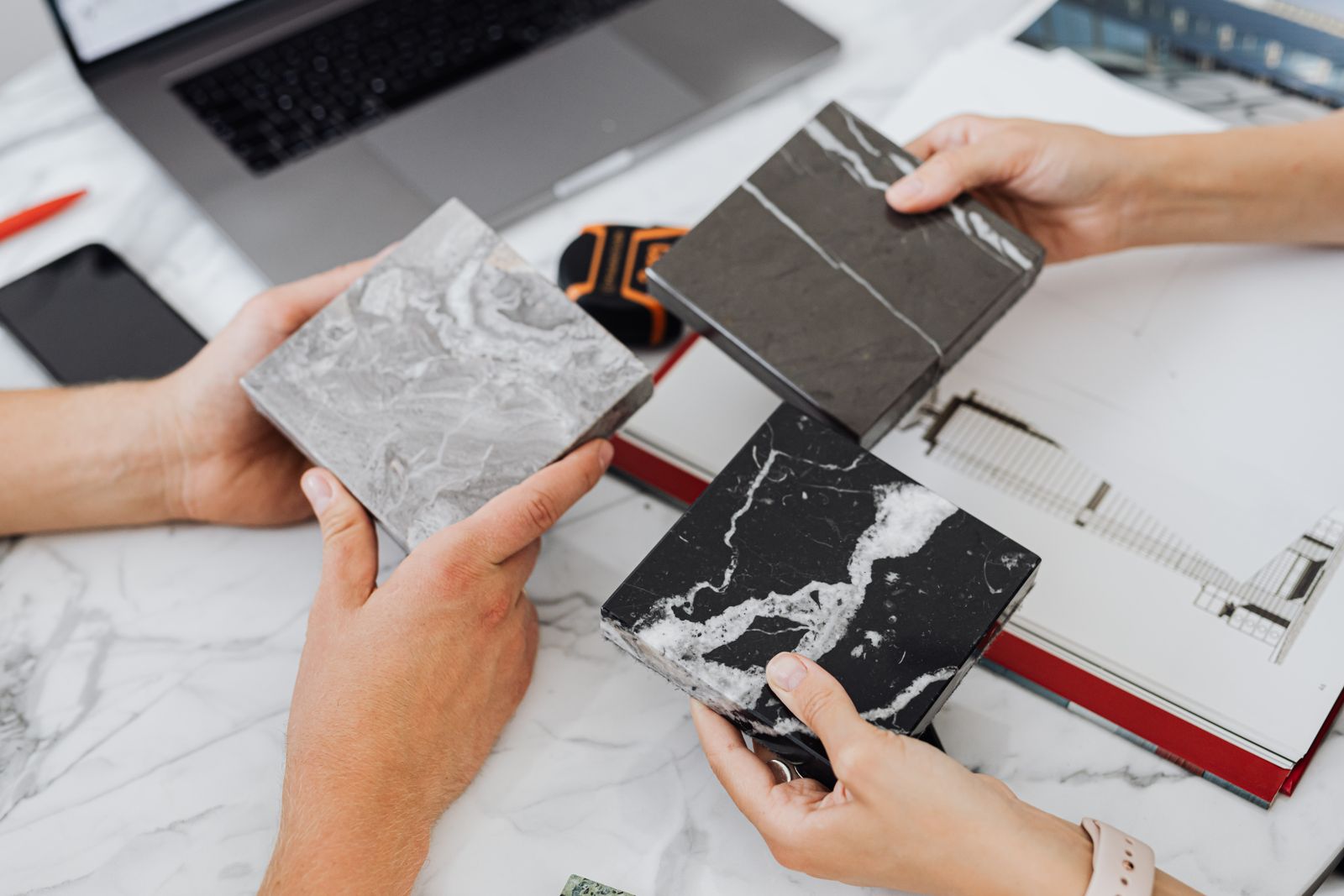 Project manager walking a client through the schedule on site