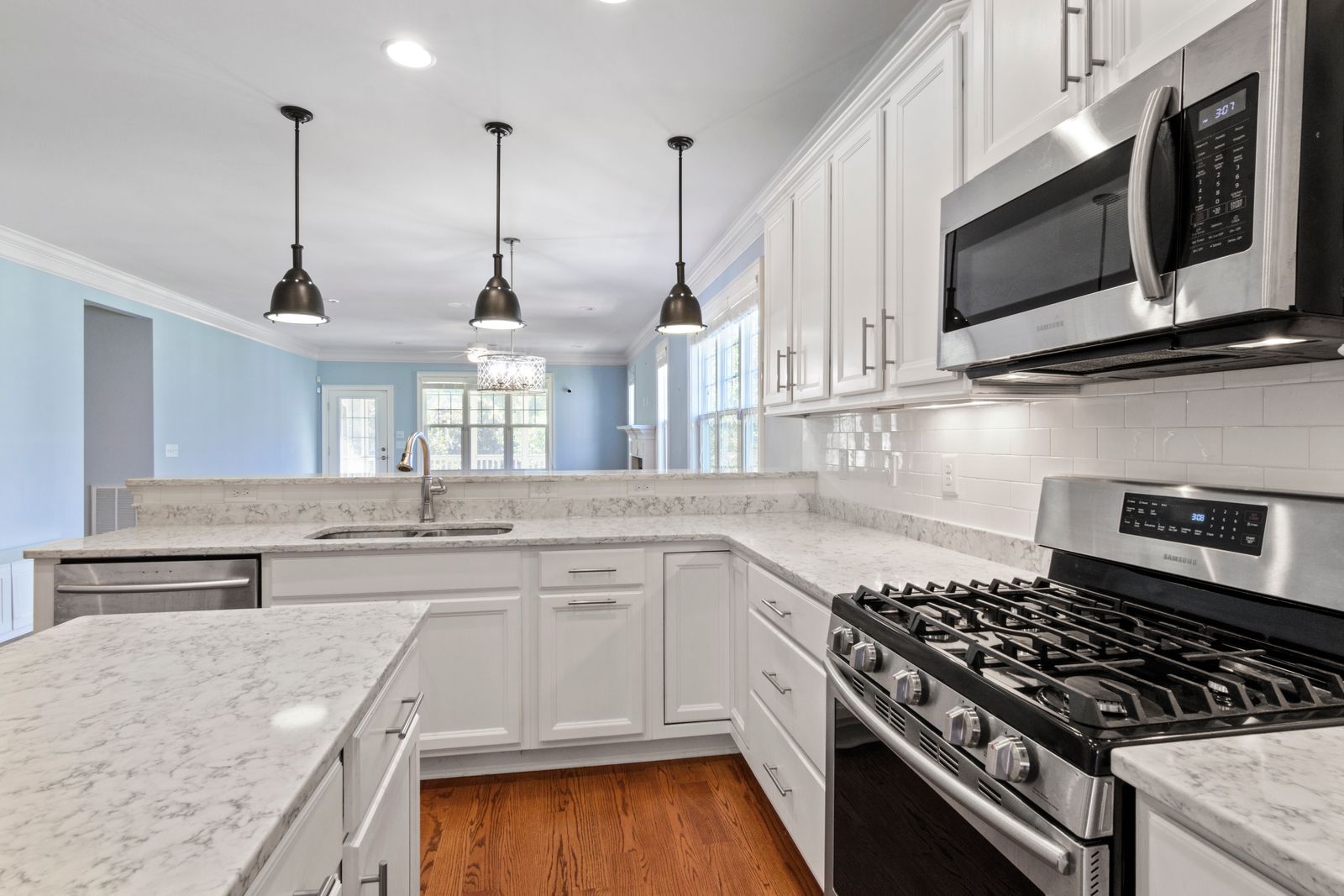 Completed kitchen remodel with new cabinetry and stone counters