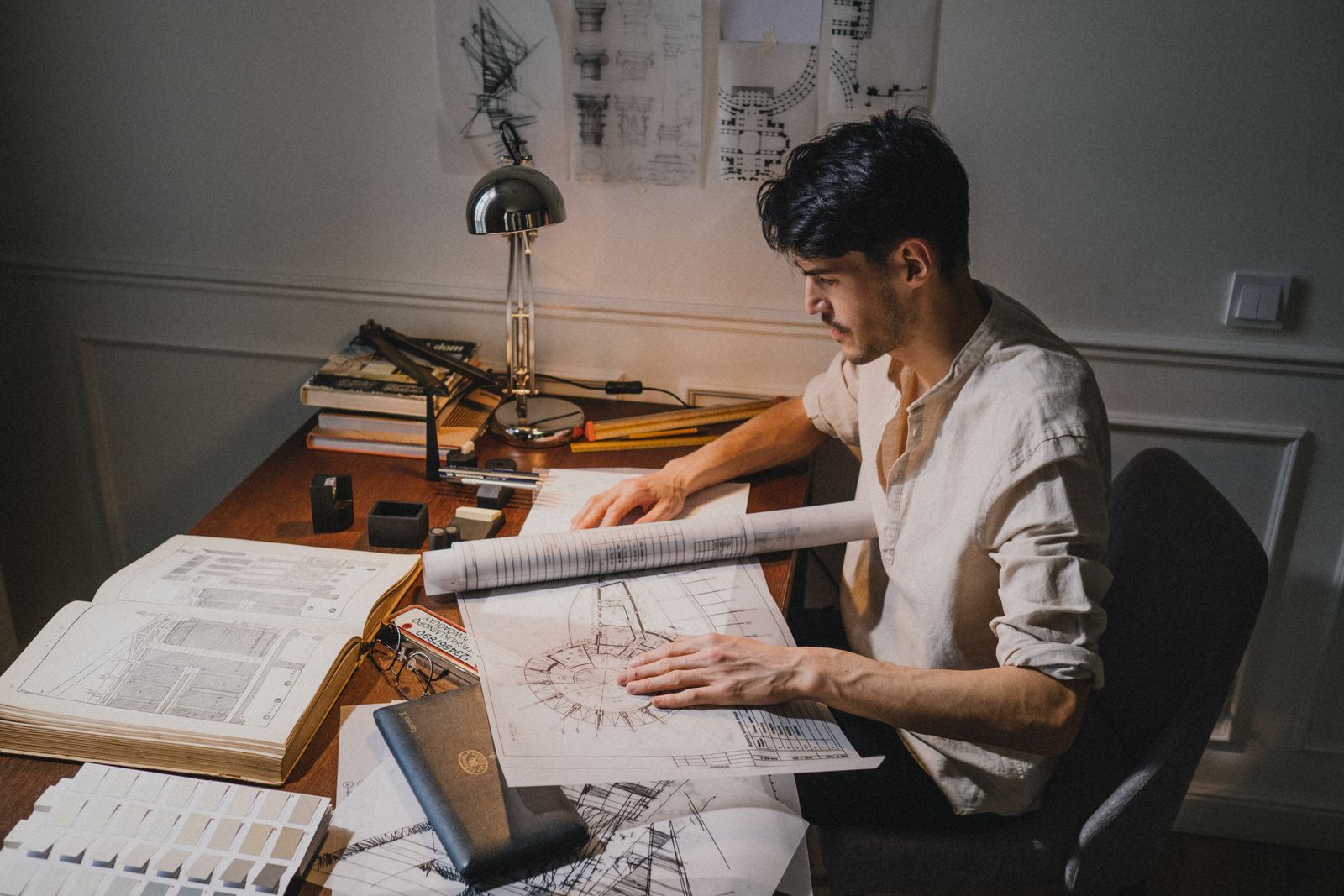 Architectural drawings and measurements on a work table